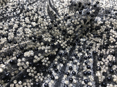 NET fabric with sequins and  pearls available in 2 colors black and white 56" wide [17807/08]