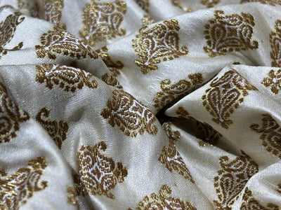 Silk Brocade fabric 44" dark ivory with antique gold jacquard motifs available in 2 designs leaf and paisley BRO1053