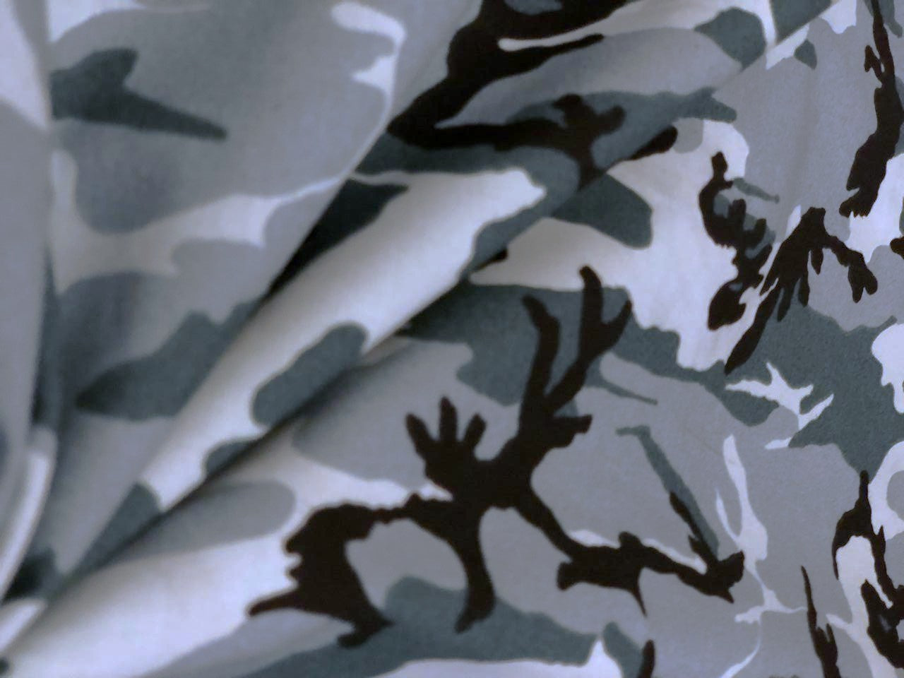 100% Cotton available in 2 prints and colors in the army  print 58" wide greens/ black and green/browns [18692/93]