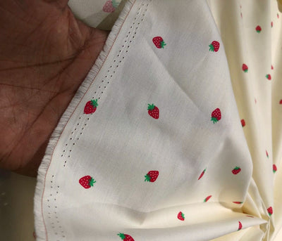 100% Cotton Poplin 58" Ivory with small red strawberry motifs [17560]