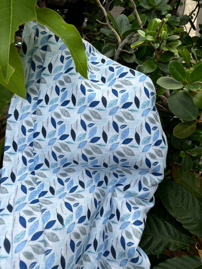 100% linen  digital print fabric 58" wide white with shades of blue leaves [16112]