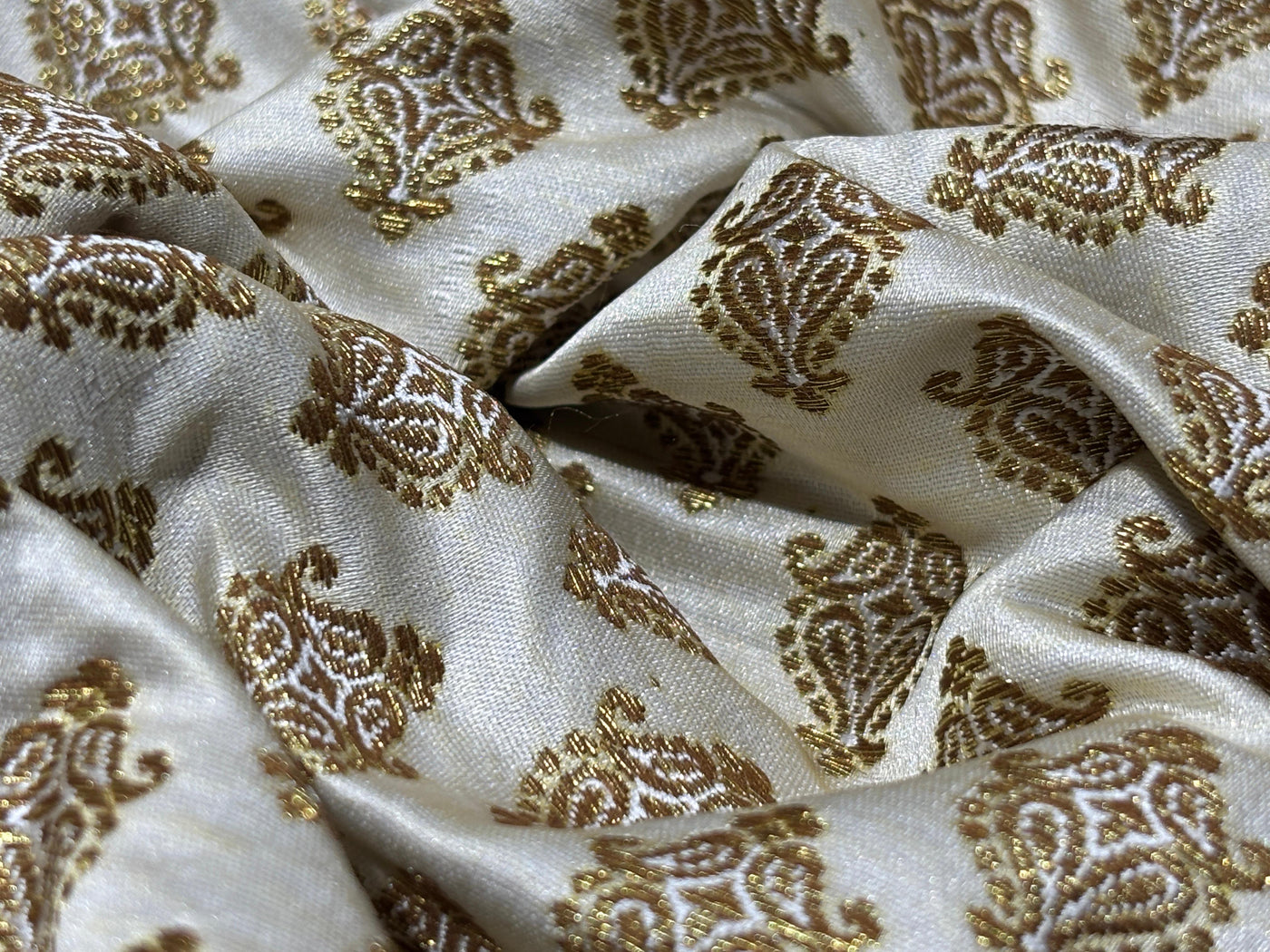 Silk Brocade fabric 44" dark ivory with antique gold jacquard motifs available in 2 designs leaf and paisley BRO1053