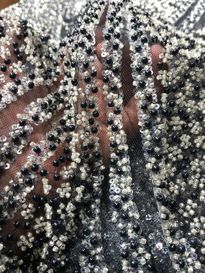 NET fabric with sequins and  pearls available in 2 colors black and white 56" wide [17807/08]