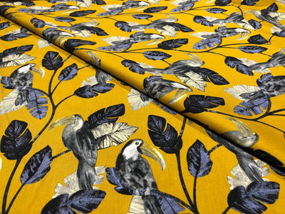100% Cotton Poplin 58" wide digital print mustard with slate blue and grey leaves with parrots  [17613]