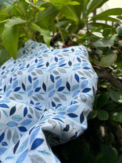 100% linen  digital print fabric 58" wide white with shades of blue leaves [16112]