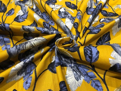 100% Cotton Poplin 58" wide digital print mustard with slate blue and grey leaves with parrots  [17613]
