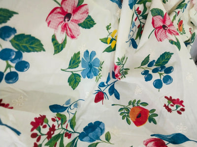 100% Cotton printed and  embroidered fabric  58 inches wide 147 cms. available in 2 colors purple orange floral and red blue floral