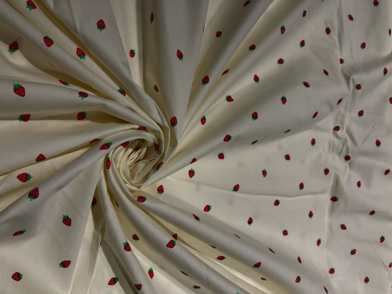 100% Cotton Poplin 58" Ivory with small red strawberry motifs [17560]