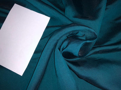 Silk Brocade fabric  with a teal  color abstract  Jacquard with subtle sequence 54" wide BRO942[4] option of buying a matching solid too .