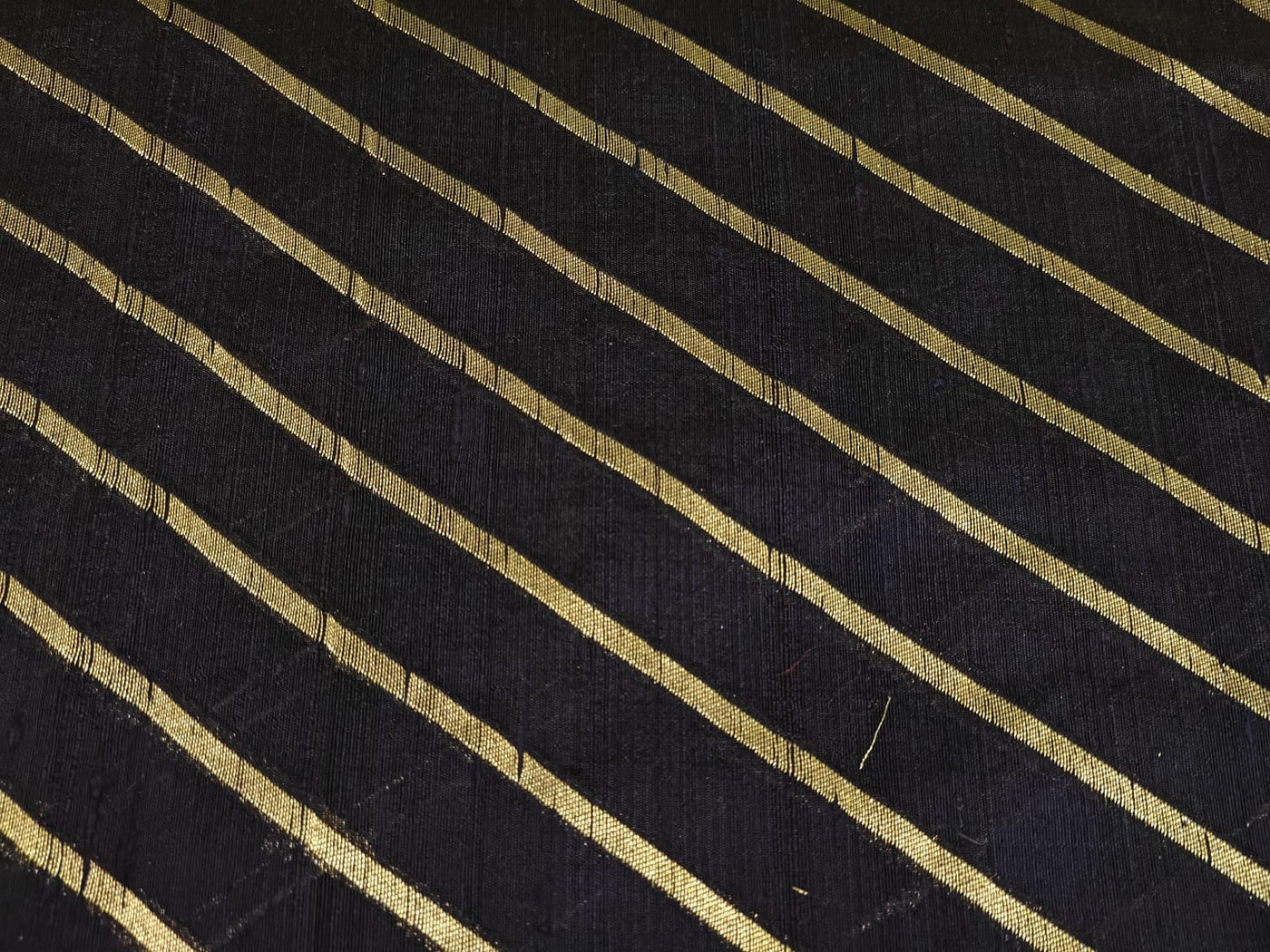 100% Silk Brocade in raw silk fabric available in 2 colors black and peacock blue with gold metallic stripe 44" wide BRO1070[3/4]