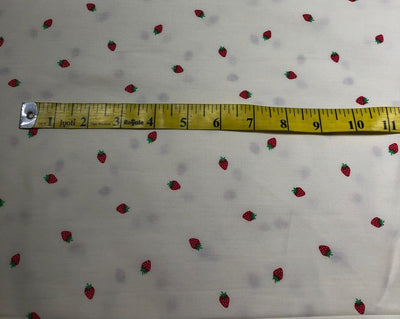100% Cotton Poplin 58" Ivory with small red strawberry motifs [17560]