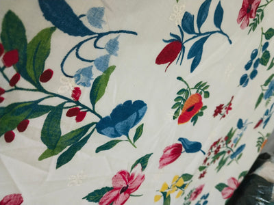 100% Cotton printed and  embroidered fabric  58 inches wide 147 cms. available in 2 colors purple orange floral and red blue floral