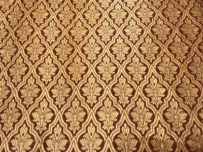 Silk Brocade fabric with subtle gold metallic jacquard motifs44" wide available in 4 colors rosy brown ,rust, bottle green and purple BRO1104