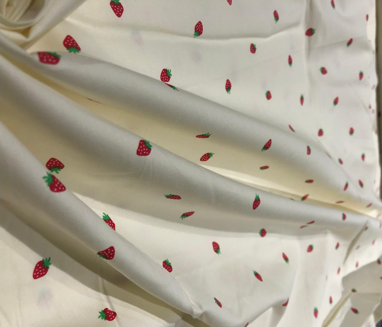 100% Cotton Poplin 58" Ivory with small red strawberry motifs [17560]