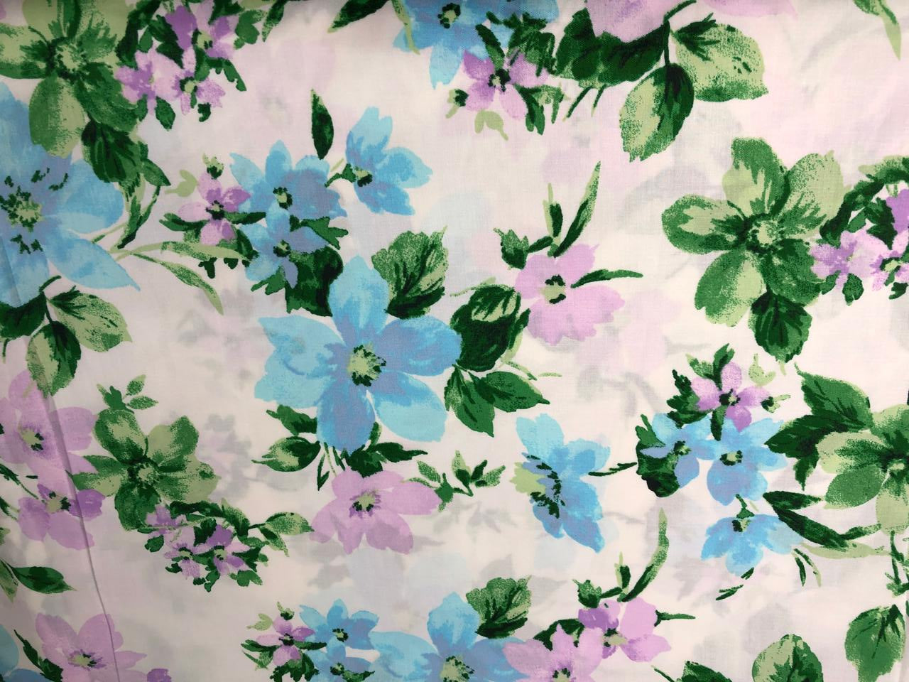 100% Cotton Poplin  Prints 58" wide available in 3 prints pastel color plaids/bunnies and cream with blue lavender floral