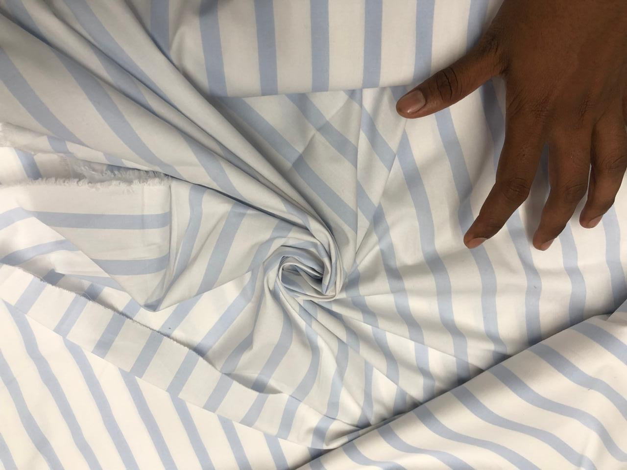 100% Cotton 58" wide available in 3 different blues pastel blue/white , navy/red/white , and blue/navy