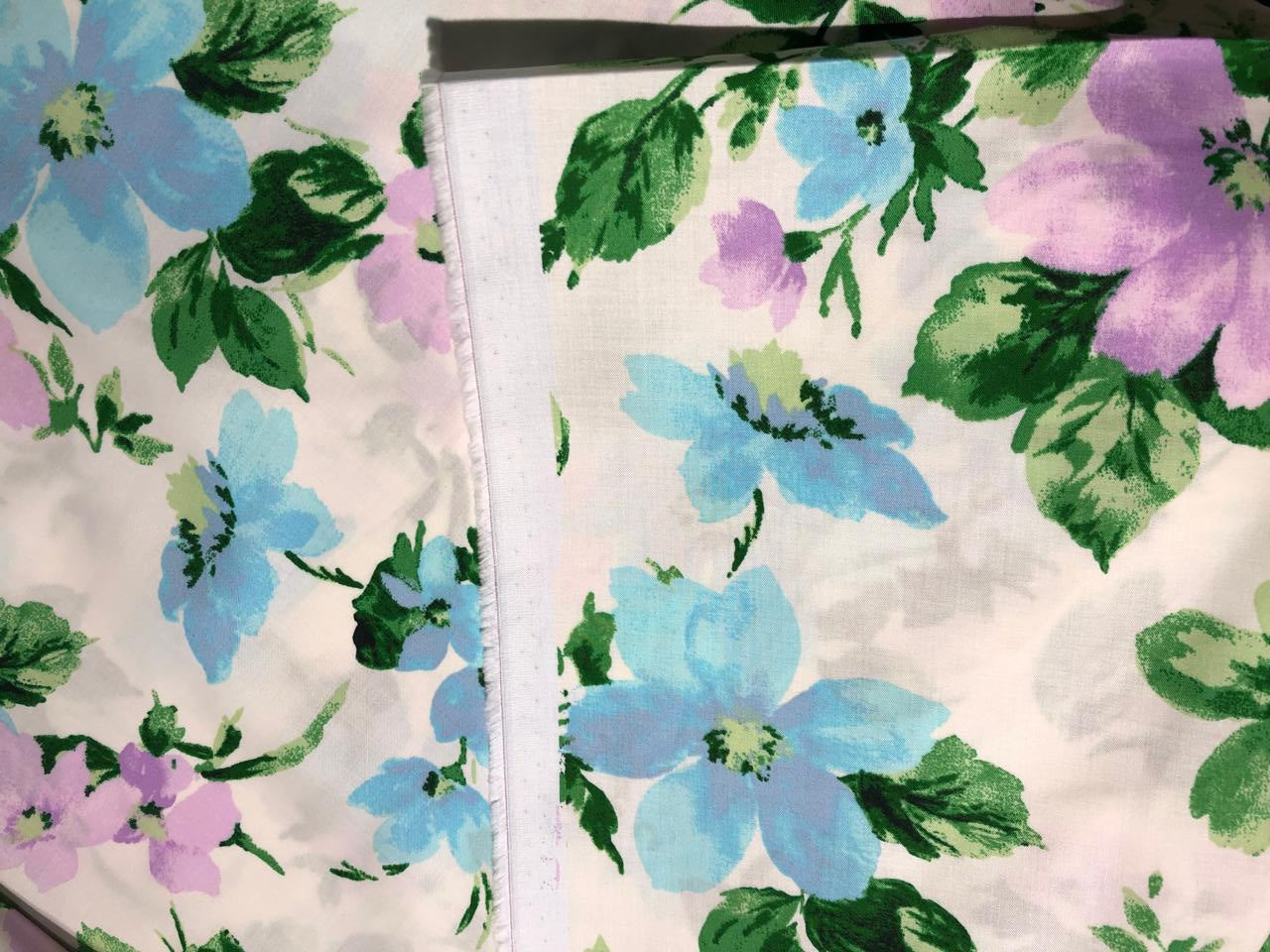 100% Cotton Poplin  Prints 58" wide available in 3 prints pastel color plaids/bunnies and cream with blue lavender floral