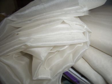 silk organza off white{light ivory} 110 inches wide{279 cms}. - The Fabric Factory