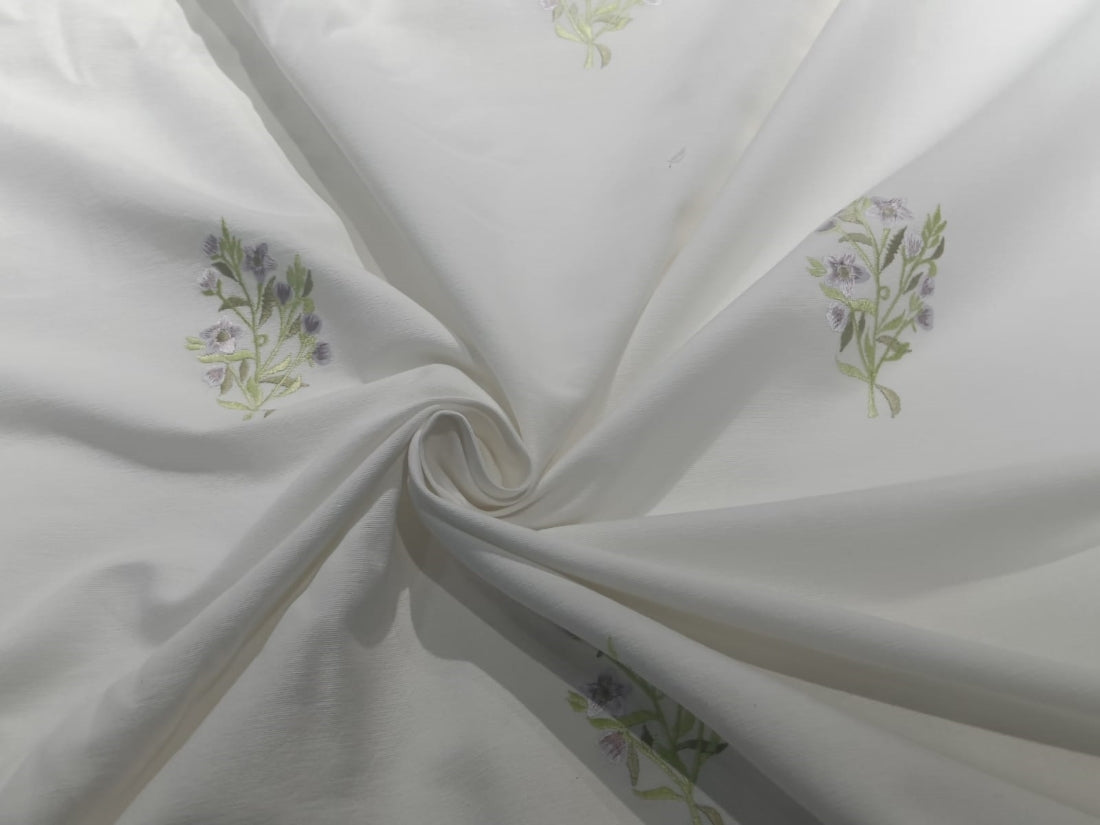 White linen fabric with embroidered motifs 54" wide