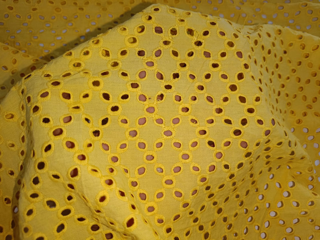 Fabric with embroidered holes top