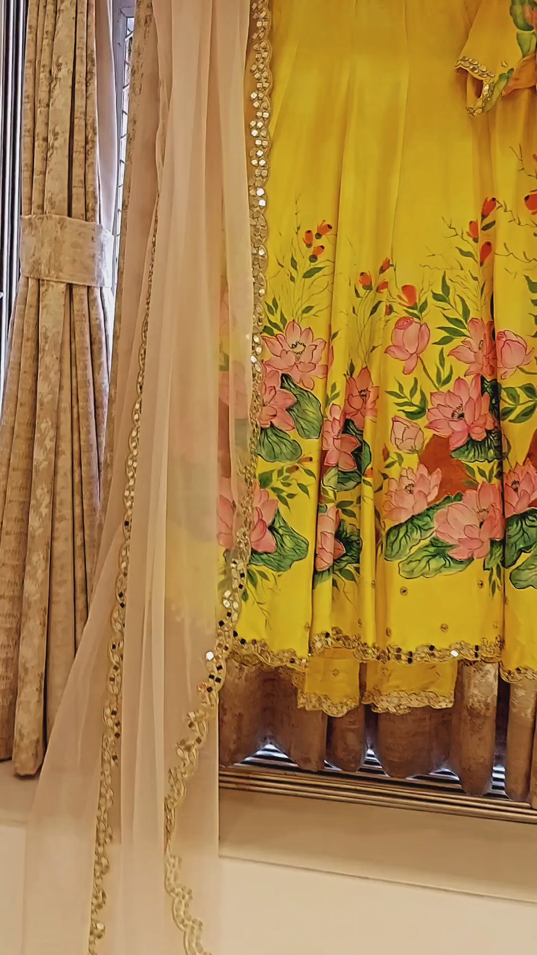 Handpainted unstitched 100% silk lehenga and blouse with lotuses on a golden yellow background